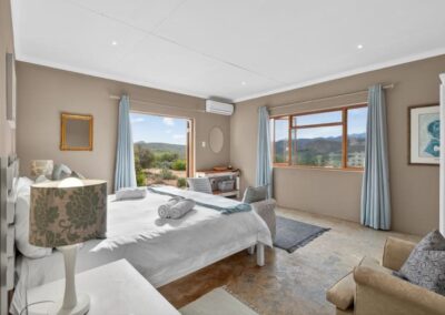 Kudu chalet's main bedroom with views of the vast Karoo plains