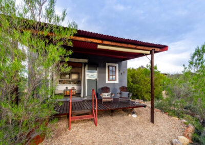 Nguni Chalet 8 Nguni chalet's exterior surrounded by the Karoo bush